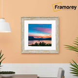 Square White Photo Frame With White hanging on a wall.