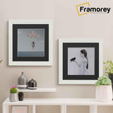 White With Black Mount Picture Frame is hanging on a wall just over the Table