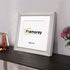 Side View Square silver Reverse Style poster frame with white mount placed on a table.