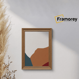 Walnut Photo Frame  is hanging on a wall