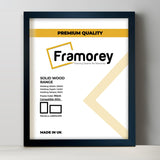 Thin Black Solid Wood picture frame shown from front view on a plain white surface standing with a wall