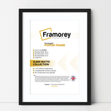 Black thin picture frame With White Mount on a plain white surface standing with a wall