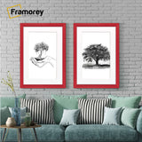Two Antique Style Red Picture Frame With White Mount hanging on a wall just over a couch.
