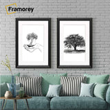 Black picture frames With White mount hanged on a wall over the sofas.