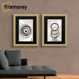 Two Glitter Sparkle Gold Picture Frame Photo Print Frame With Black Mount hanging on a wall just over a couch.