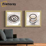 Two Gold Square Size Picture Frame hanging on a wall.