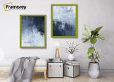 Two Lime Green picture frame hanged on a wall over some furniture.