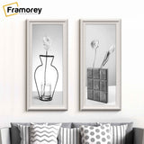 Two Panorama Style White Picture Frame hanging on a wall over the couch.