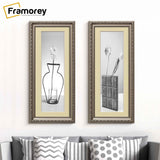 Two Panoramic Gun Metal Photo Frame Shabby Wall Frames With Ivory Mount hanging on a wall in a row just over a couch.