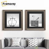 Square Gun Metal Picture Frame With Black Mount hanging on a wall just over the couch.