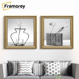 Square gold photo frames hanged on a wall over the couch.