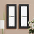 Two Thin Matt Panoramic Black Poster Frame With Black Mount hanging on a wall.