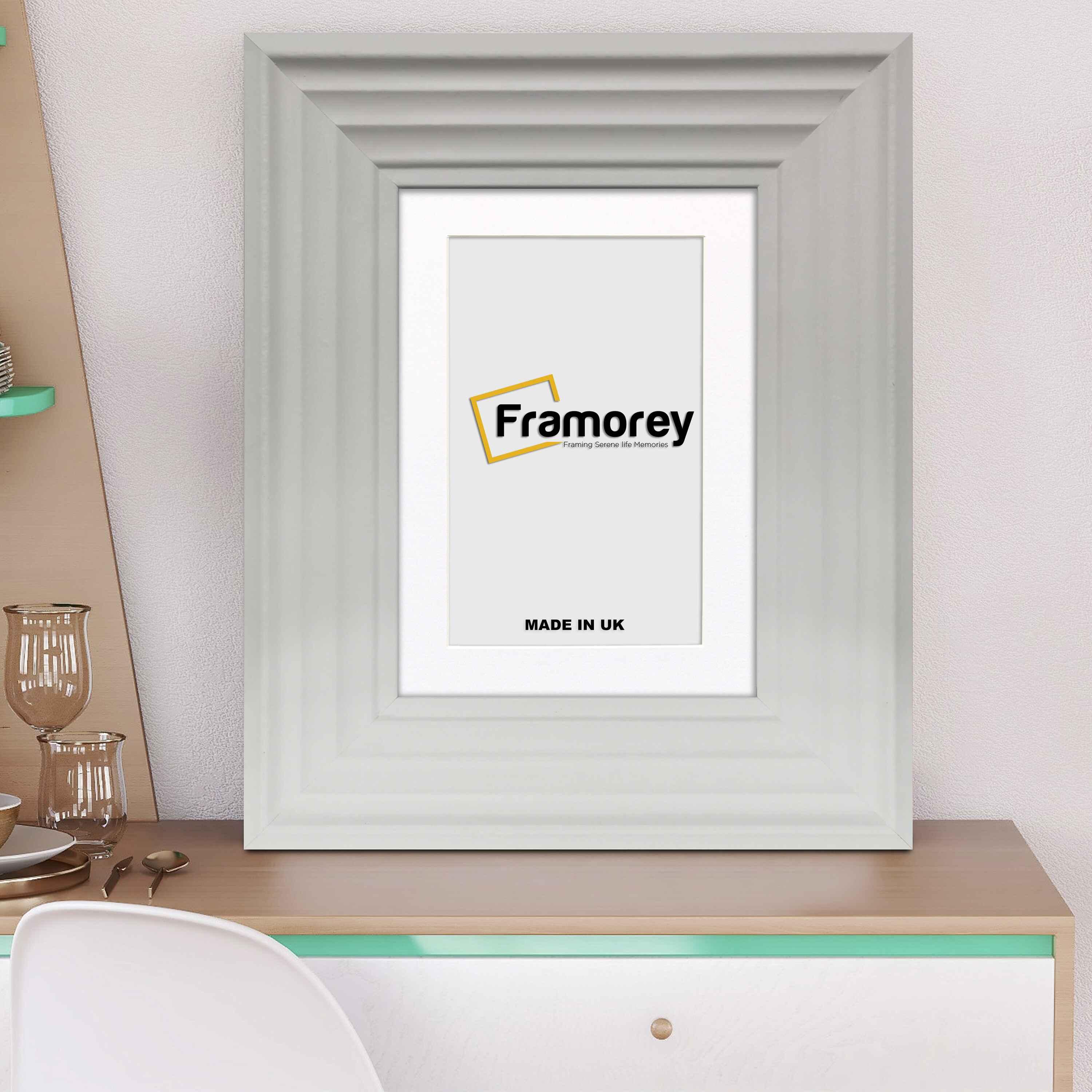 White Wooden Picture Frames Big Step Style with white mount placed on a table.