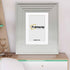 White Wooden Picture Frames Big Step Style with white mount placed on a table.