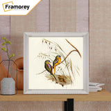 White Square Reverse Style PHoto Print Frame is placed on a wooden table