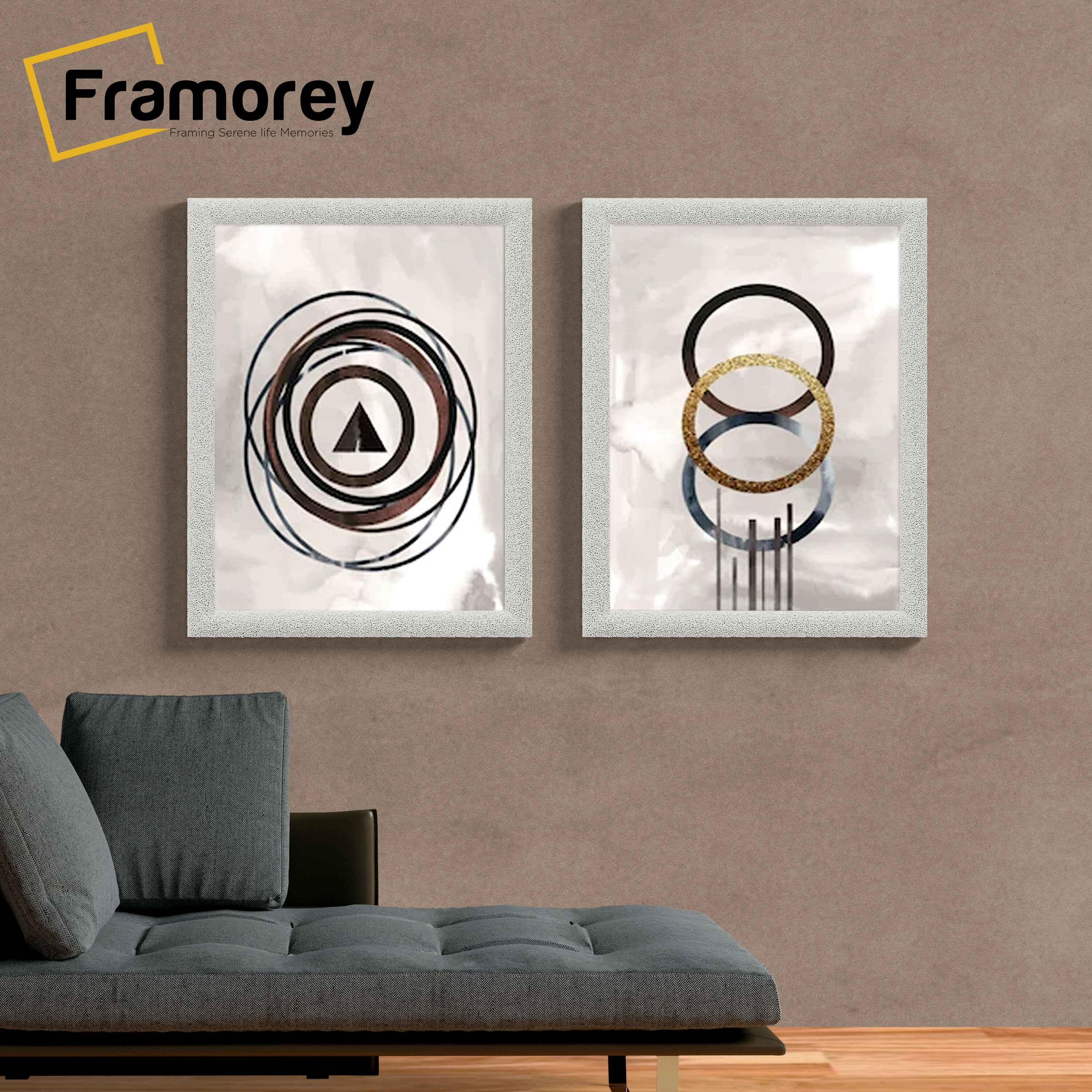 Two White glitter photo frames  Hanged on a wall.