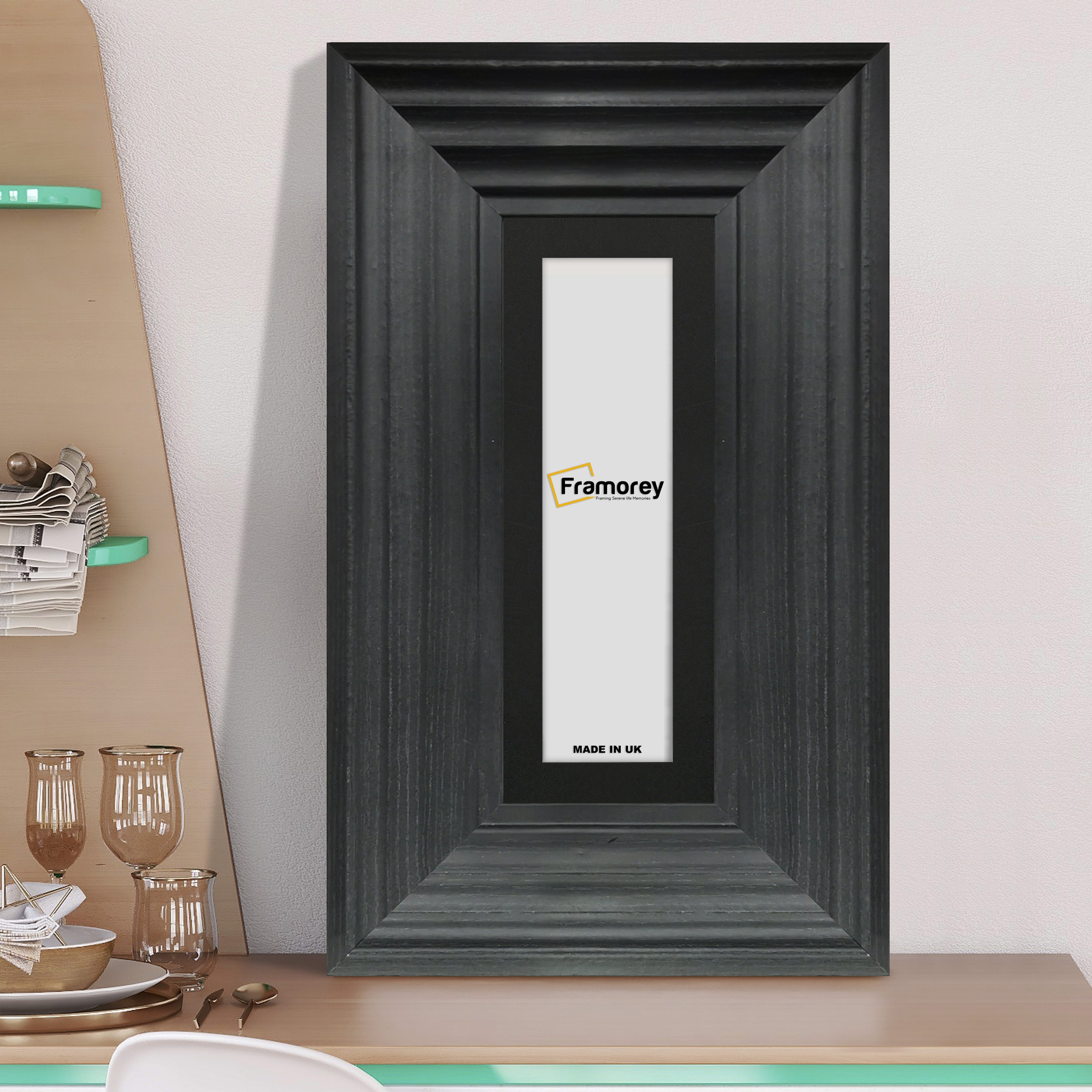 Panoramic Size Black Wooden Poster Frame Big Step With Black Mount on a wooden drawer leaning with the wall.