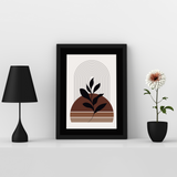 Front View of a Black Frame with Black Bevel Cut Mount place on a wooden table with some decorative items in this image.