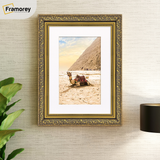 lifestyle image of a gold With white mount traditional ornate Dahlia photo frame on wall décor