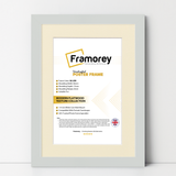 Silver Picture Frame With Ivory Mount leaning with a wall on a wooden floor with some detail on its measurement.