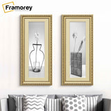  two Panoramic Gold Photo Frame With Ivory Mount hanging on the wall.